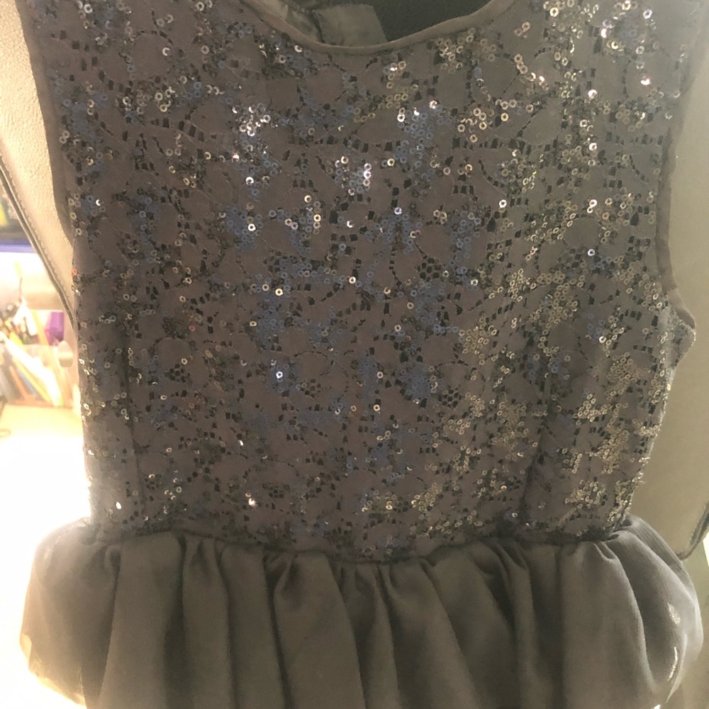 H&M’s Black sequin top/tulle layered lower bottom